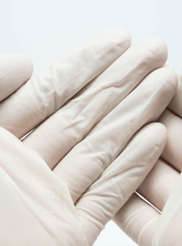 disposable sterile white latex gloves on white background