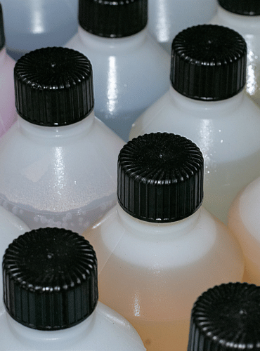 industrial chemicals in plastic botles with black plastic cork